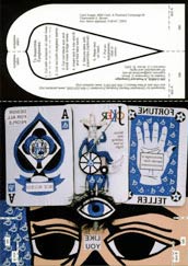 A postcard that can be cut out and assembled into a partial mask features eyes (to be cut out), a furrowed brow with a third eye and three playing cards displaying an ace, a joker and a Fortune Teller card depicting a human palm. All the printed text on the cards is backwards.